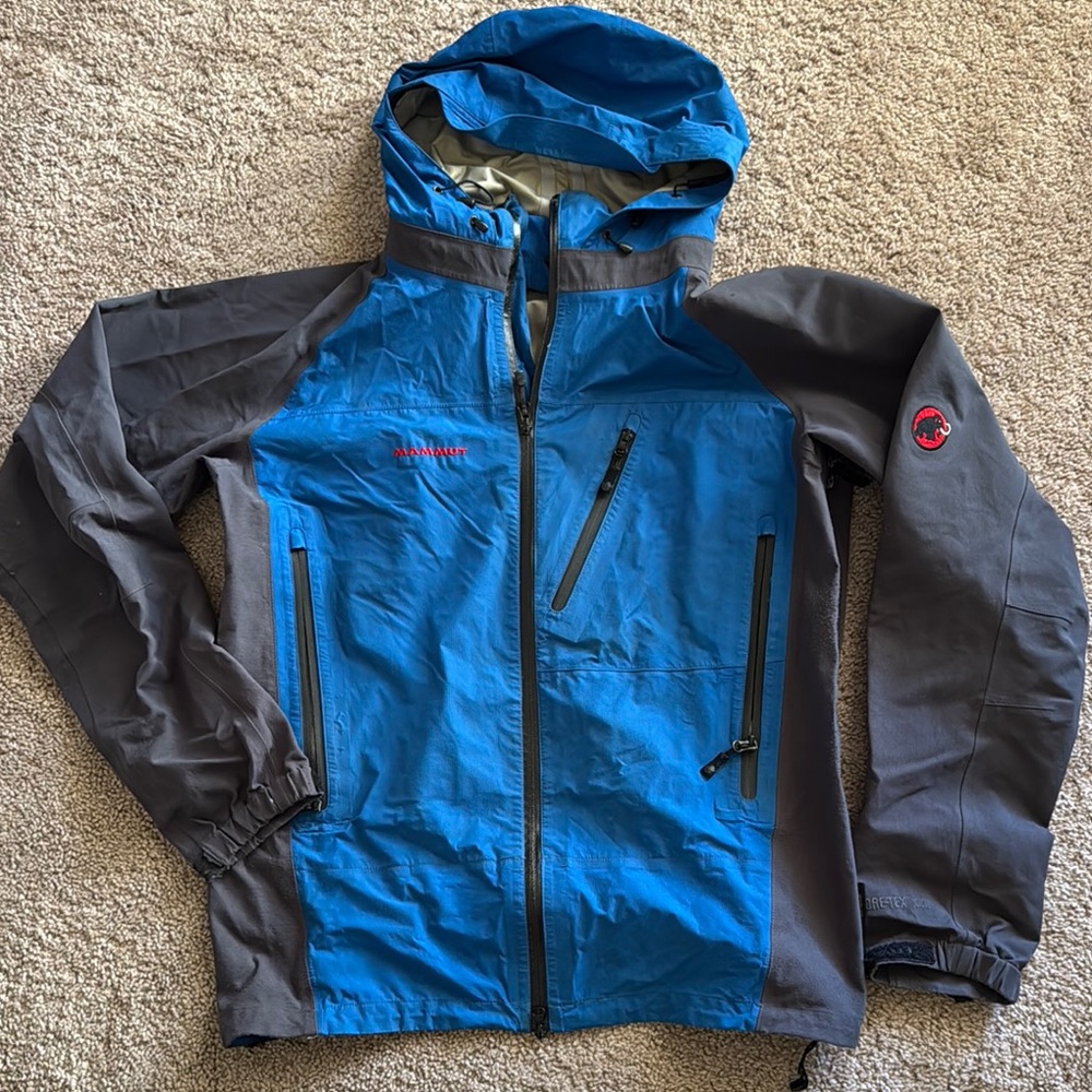 Mammut Blue and Gray Hooded Raincoat for Outdoor Adventures